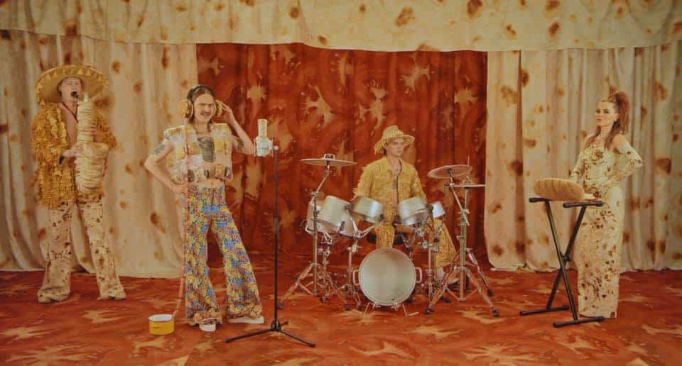 A band performing music in a room.