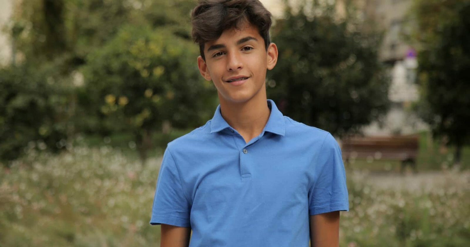 young man, blue shirt