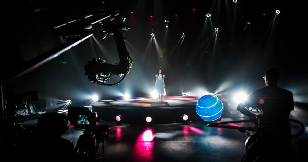 A group of people performing on a stage.