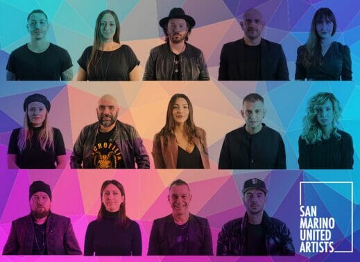 A group of people posing in front of a vibrant background.